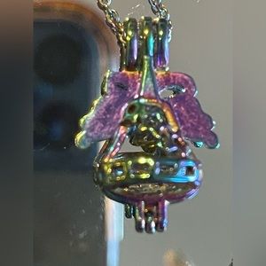 Holiday bell/bow necklace rainbow changing colors Christmas New Year’s